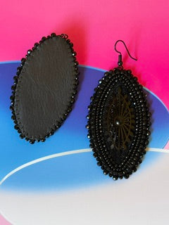 Black horse eye earrings